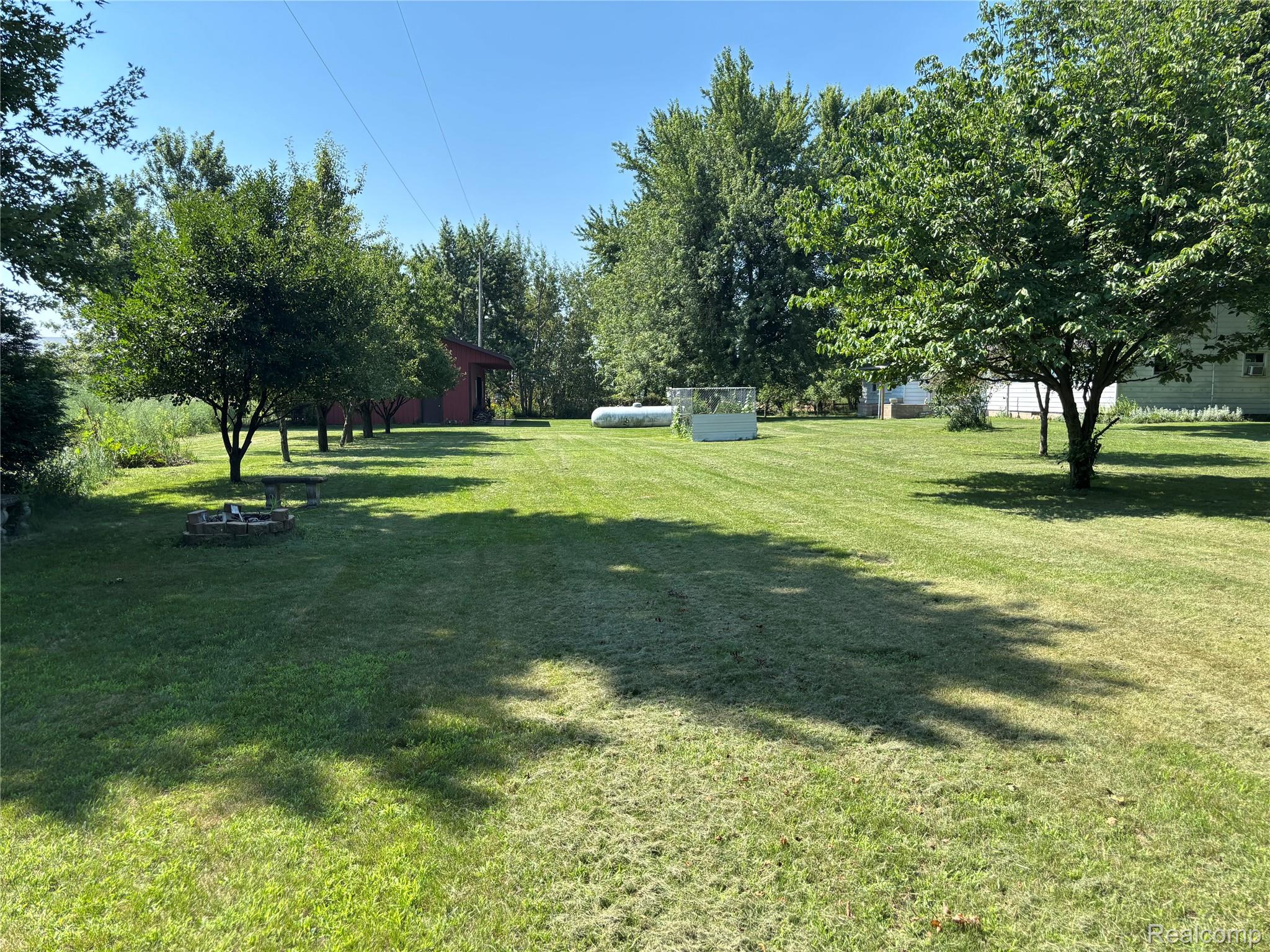 8531 South Waldron Road Pittsford, MI 49271 - Photo 37 of 40 Expansive green lawn with scattered deciduous trees