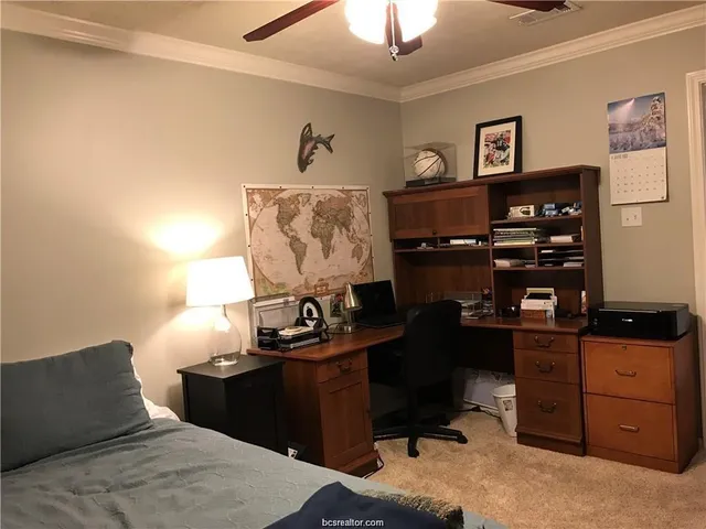 a bedroom with a bed and furniture