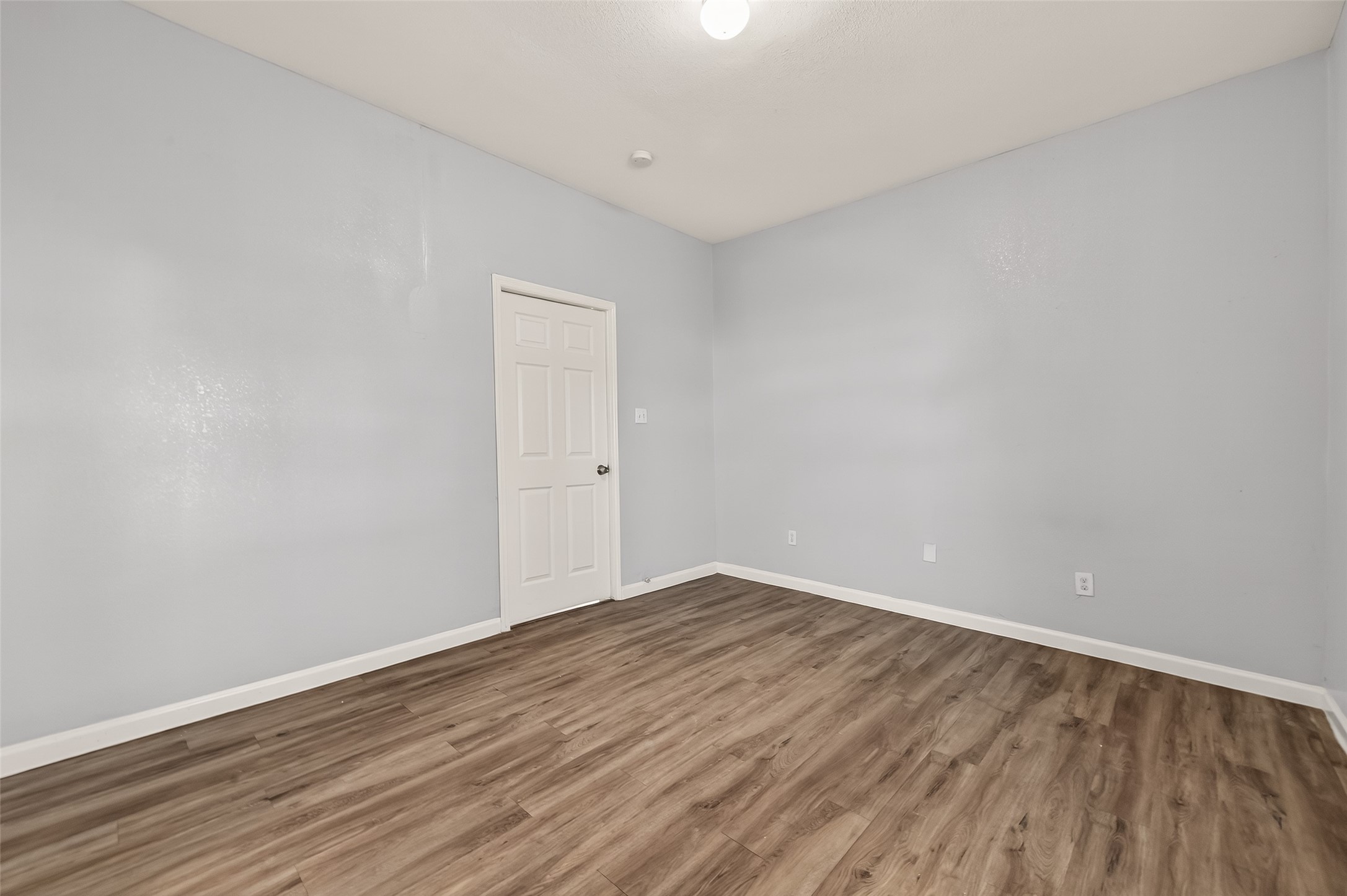 8211 Parnell Street Houston, TX 77051 - Photo 11 of 22 a view of an empty room with wooden floor