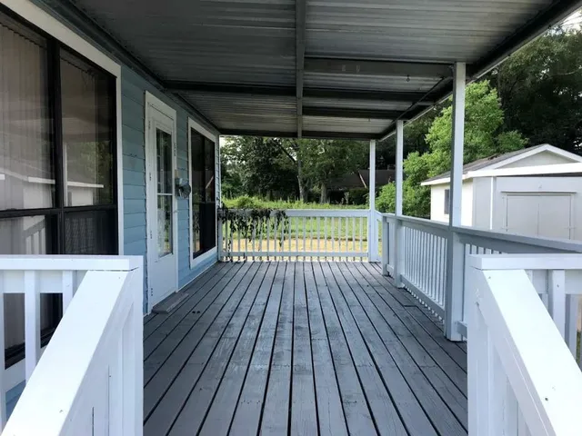 a view of porch with wooden floor and outdoor space