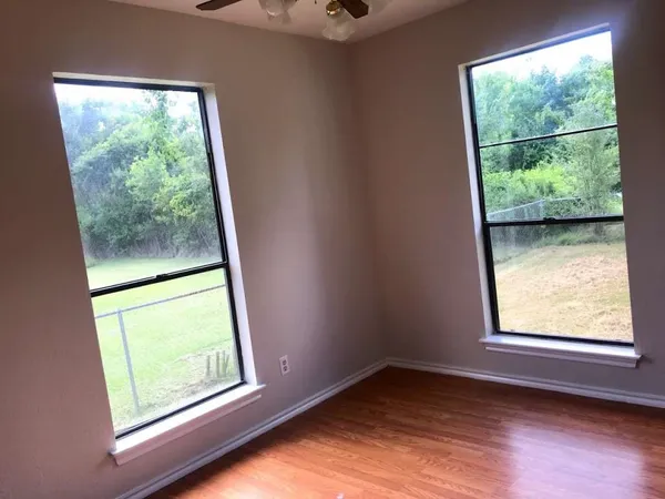 a view of an empty room with a window