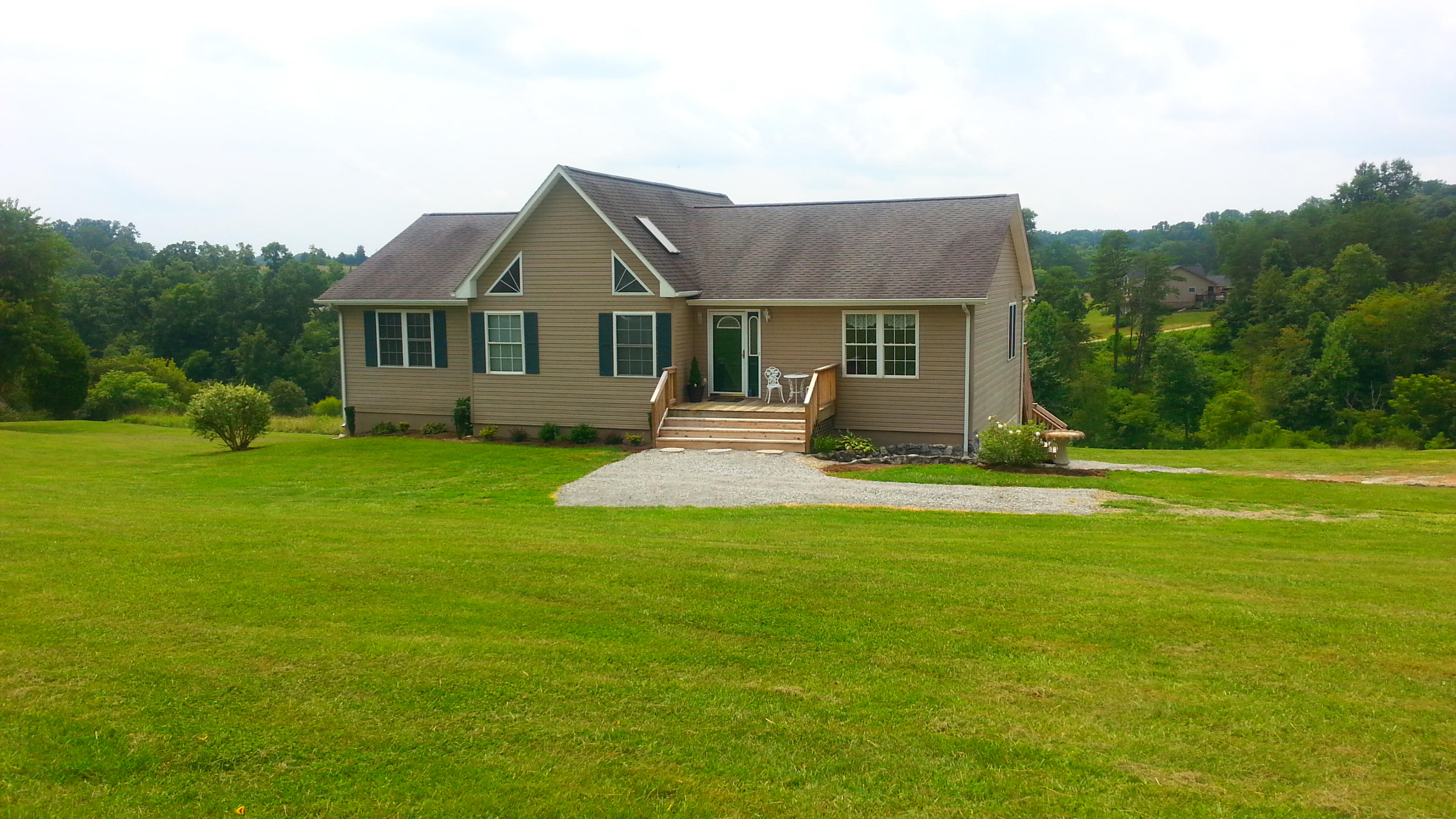 1681 Blankenship Road Goodview, VA 24095 - Photo 1 of 23 a front view of a house with a yard