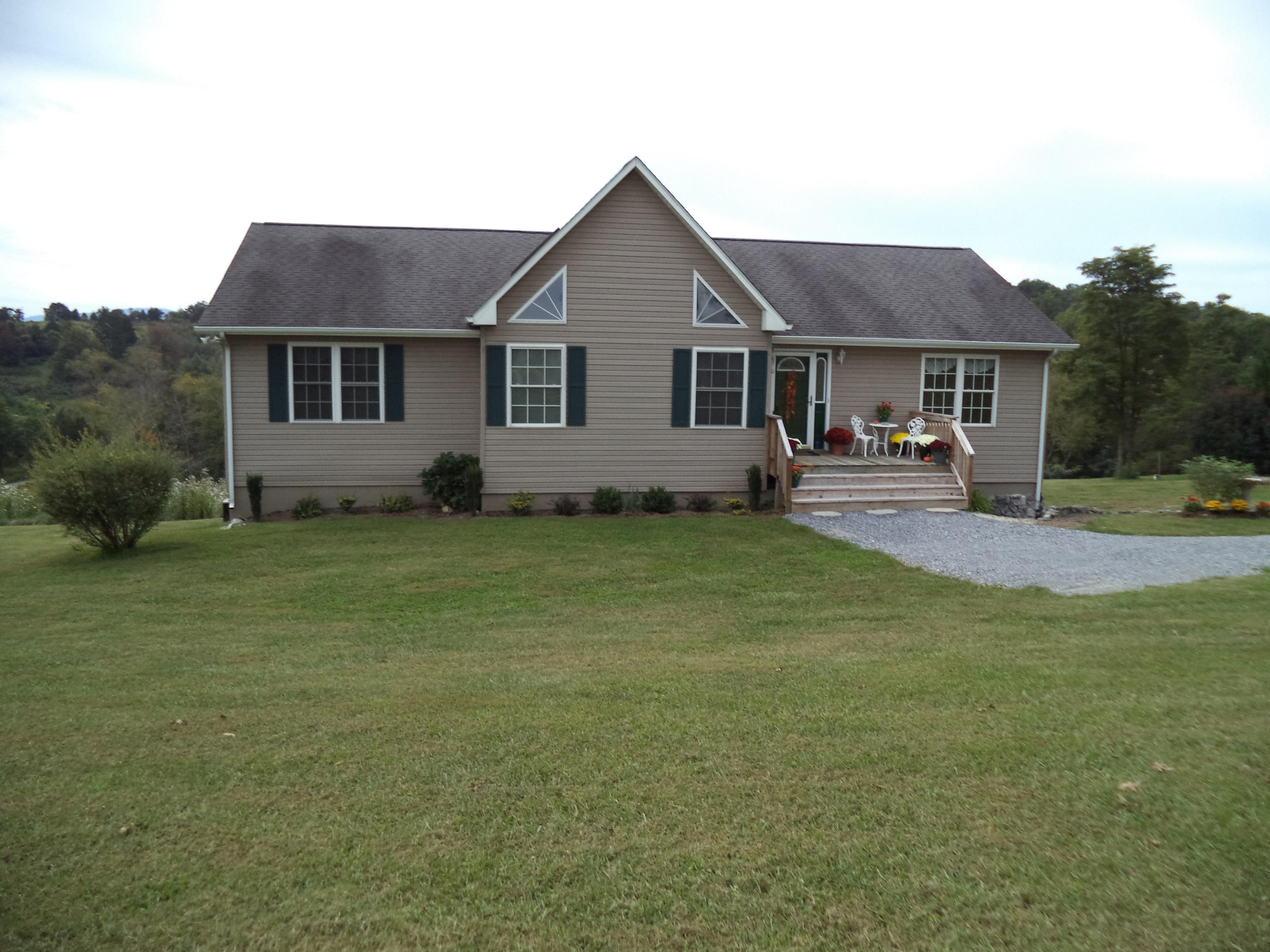 1681 Blankenship Road Goodview, VA 24095 - Photo 2 of 23 a front view of a house with garden