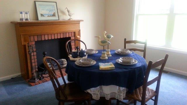1681 Blankenship Road Goodview, VA 24095 - Photo 13 of 23 a dining room with furniture wooden floor a potted plant and a fireplace