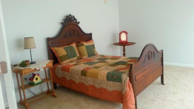 1681 Blankenship Road Goodview, VA 24095 - Photo 14 of 23 a bedroom with a bed and a lamp on dresser