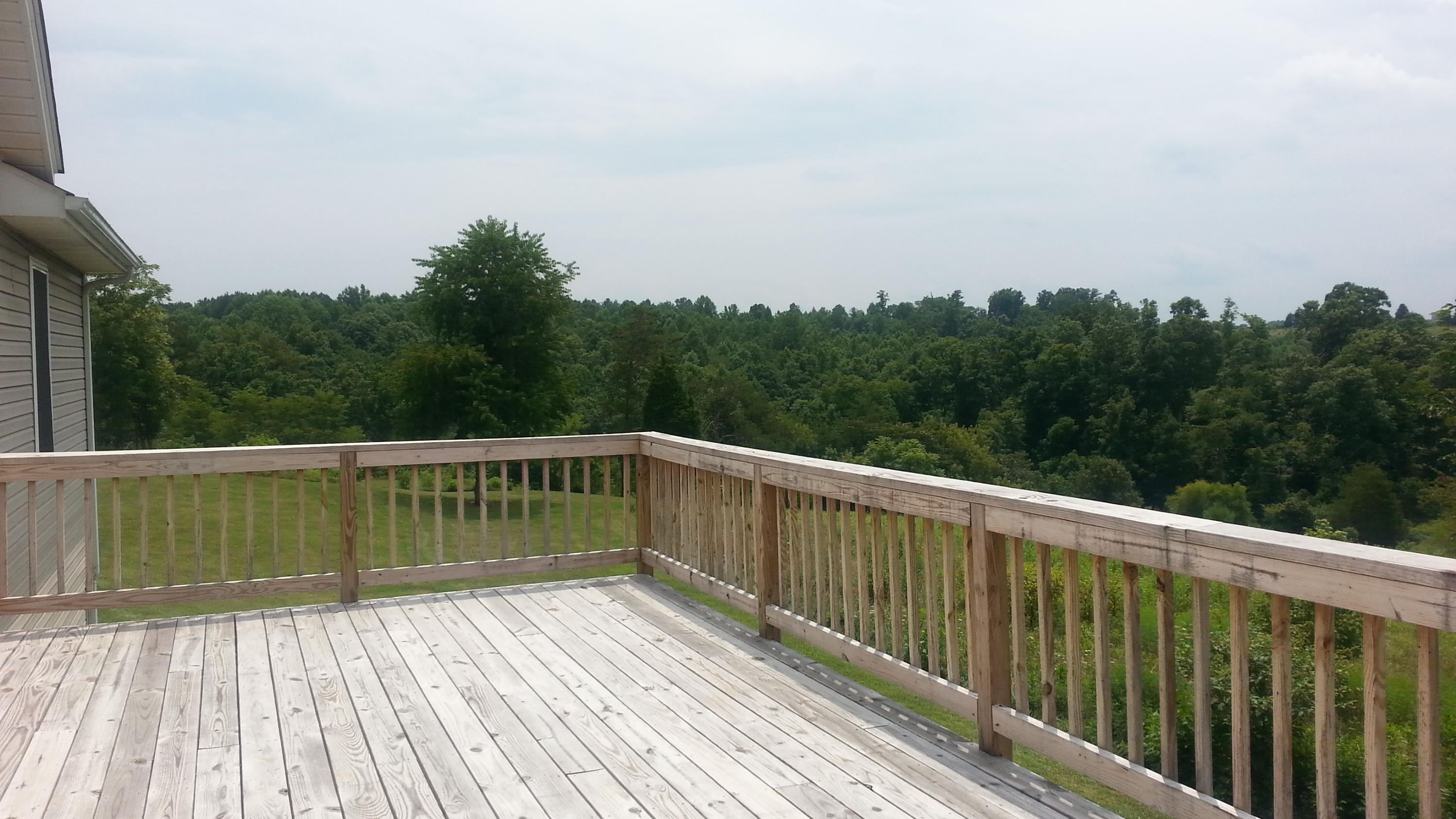 1681 Blankenship Road Goodview, VA 24095 - Photo 21 of 23 a view of balcony with wooden floor and fence