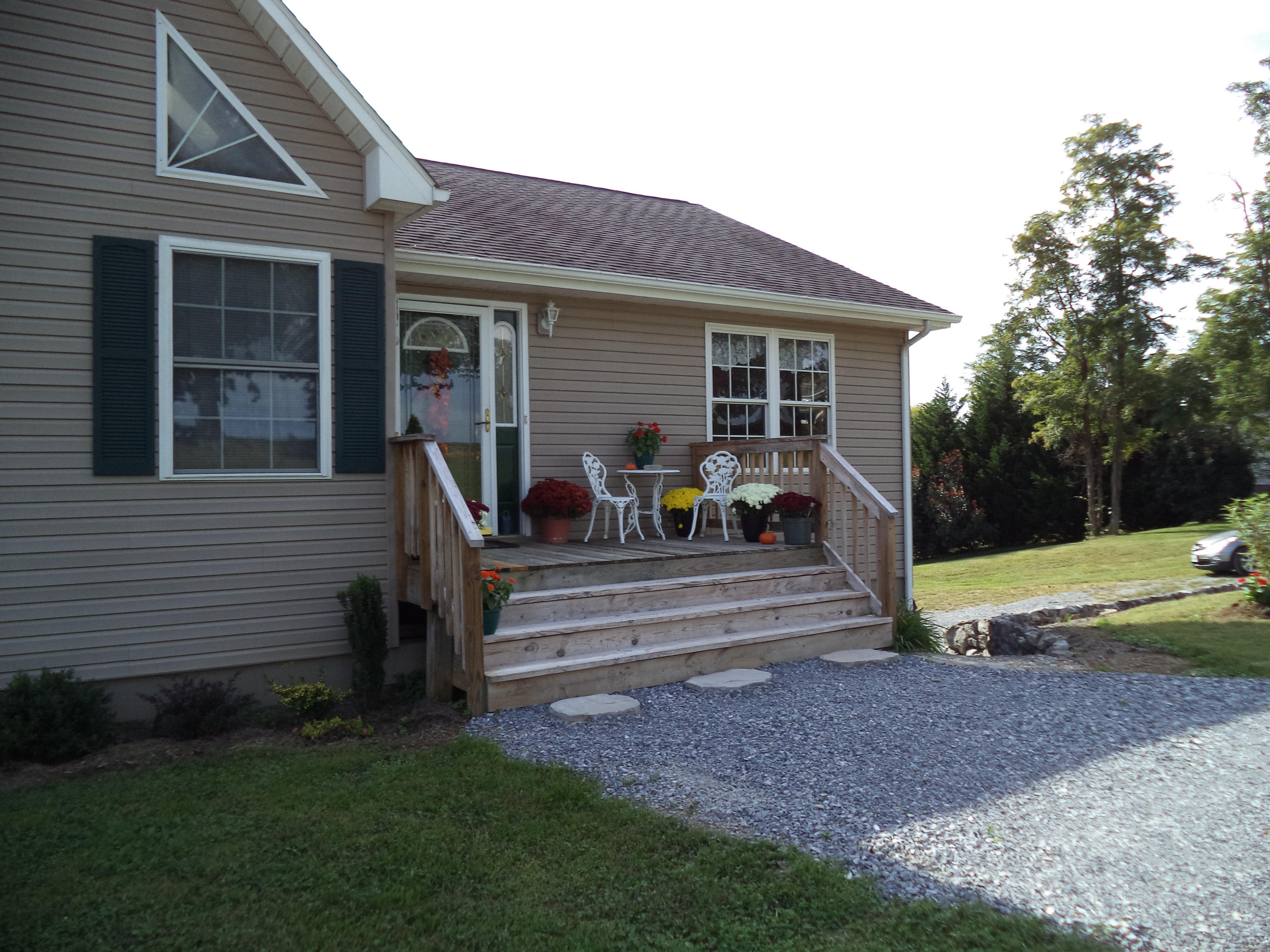 1681 Blankenship Road Goodview, VA 24095 - Photo 4 of 23 a view of a house with backyard sitting area and a garden