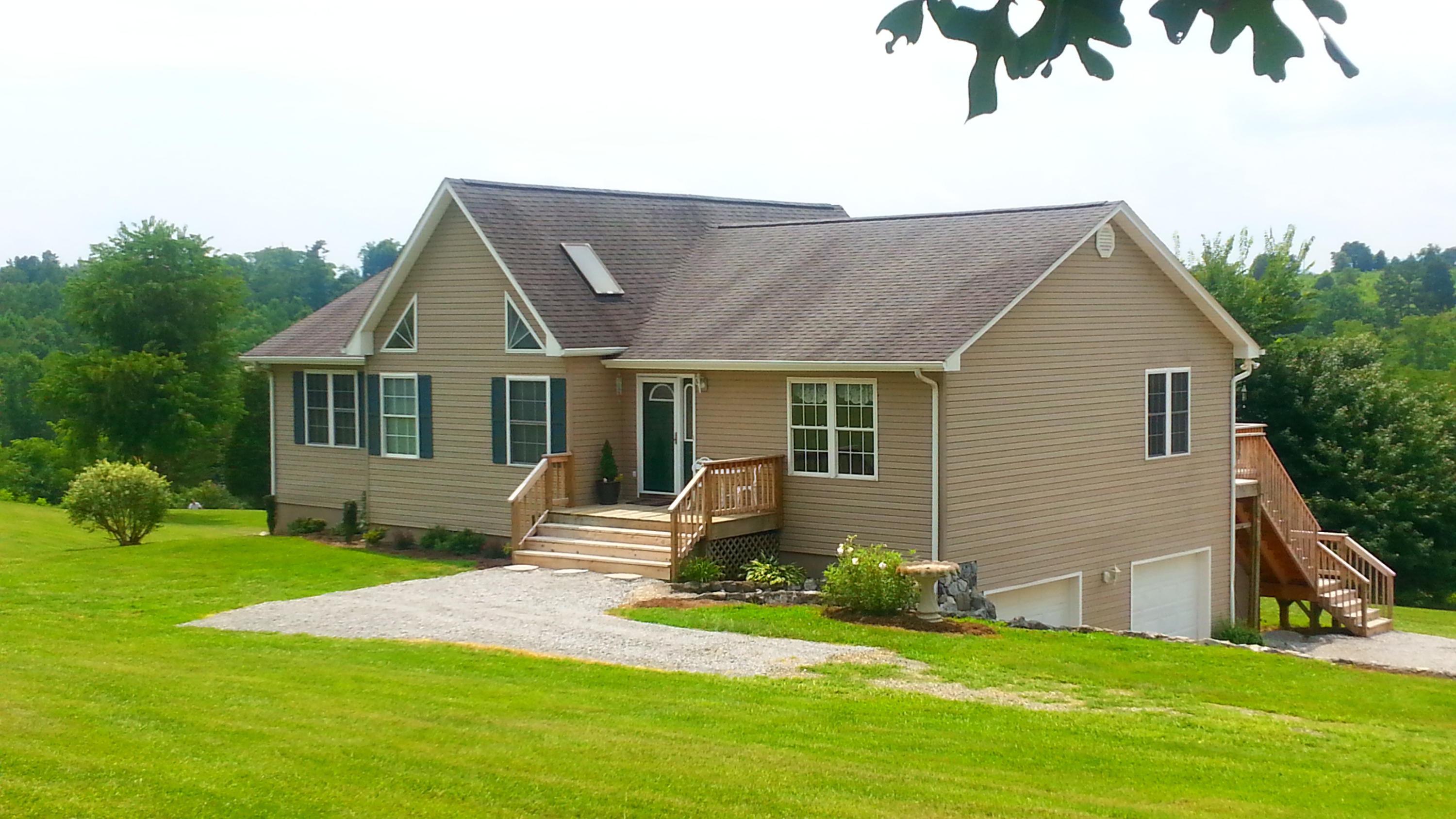 1681 Blankenship Road Goodview, VA 24095 - Photo 5 of 23 a front view of a house with a yard and porch