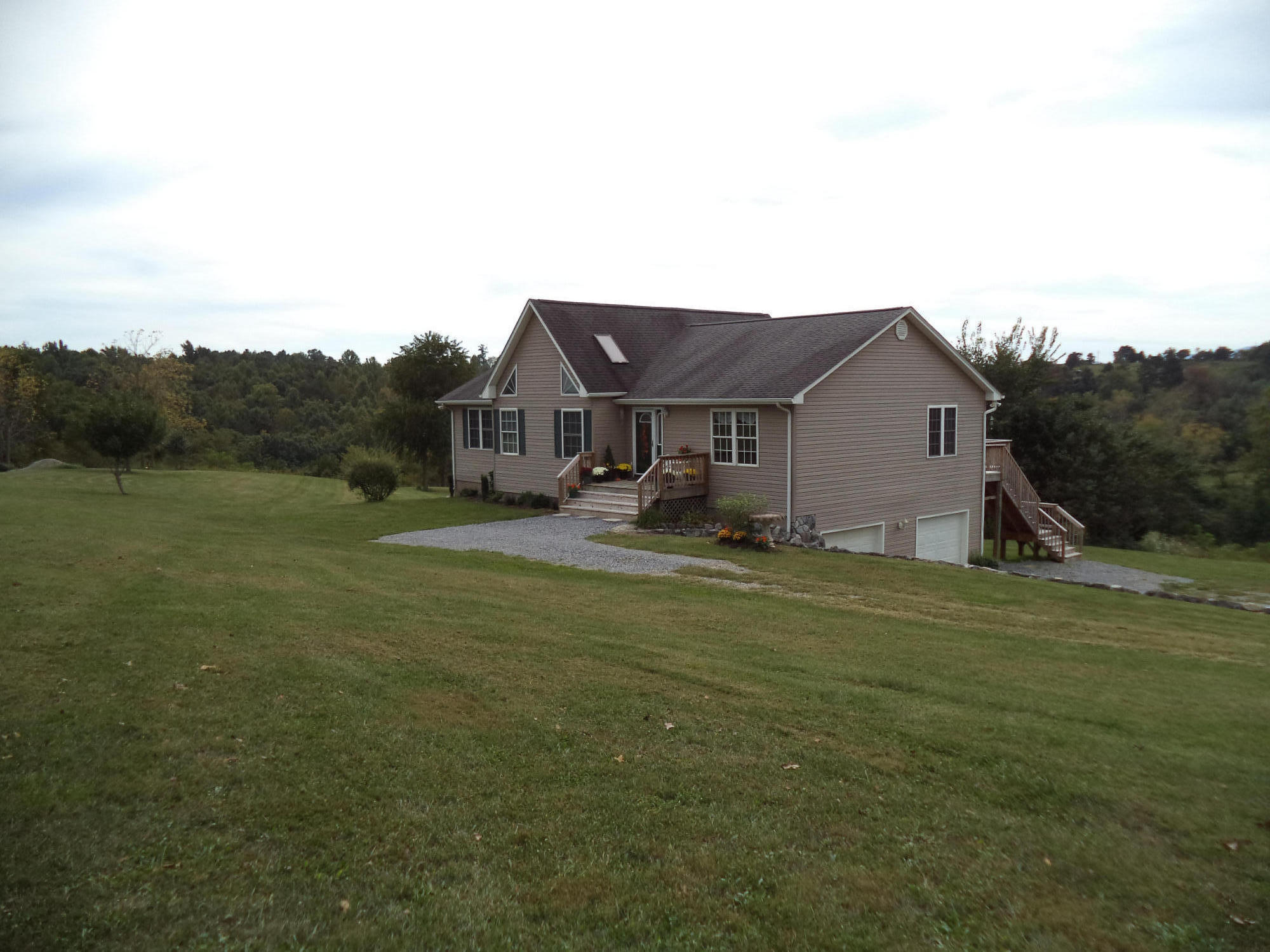 1681 Blankenship Road Goodview, VA 24095 - Photo 6 of 23 a view of a big house with a big yard and large trees