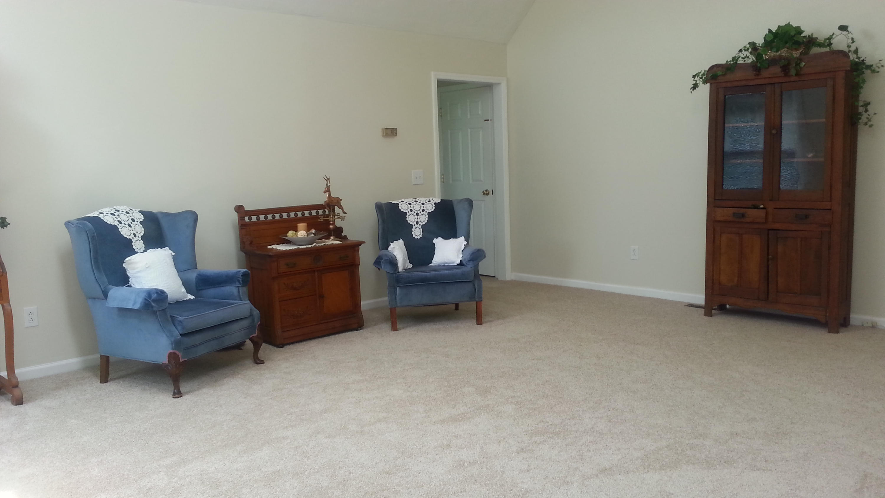 1681 Blankenship Road Goodview, VA 24095 - Photo 10 of 23 a living room with furniture and a wooden closet