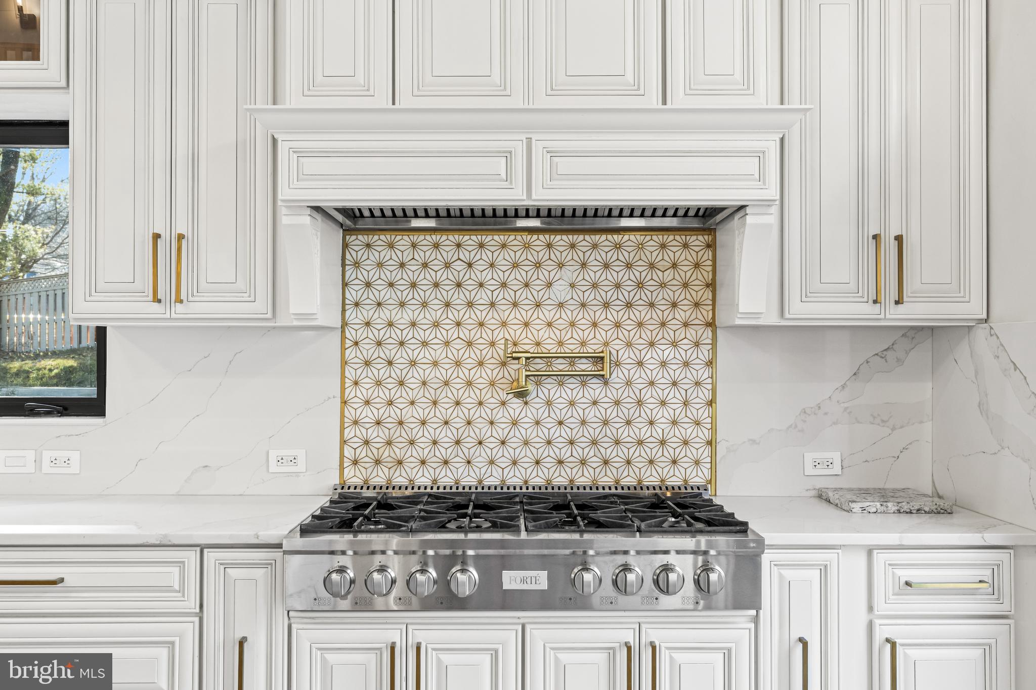 12206 Cleghorn Road Cockeysville, MD 21030 - Photo 16 of 76 a kitchen with white cabinets and black appliances