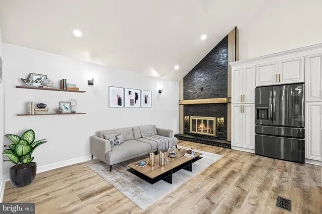 a view of staircase with railing and white walls