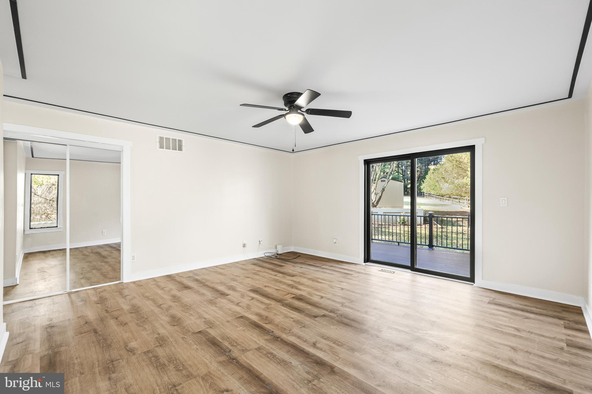 12206 Cleghorn Road Cockeysville, MD 21030 - Photo 25 of 76 a view of empty room with wooden floor and fan