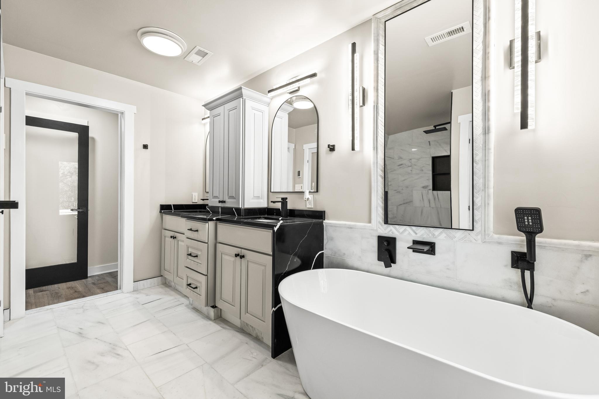 12206 Cleghorn Road Cockeysville, MD 21030 - Photo 29 of 84 a bathroom with a tub sink and mirror