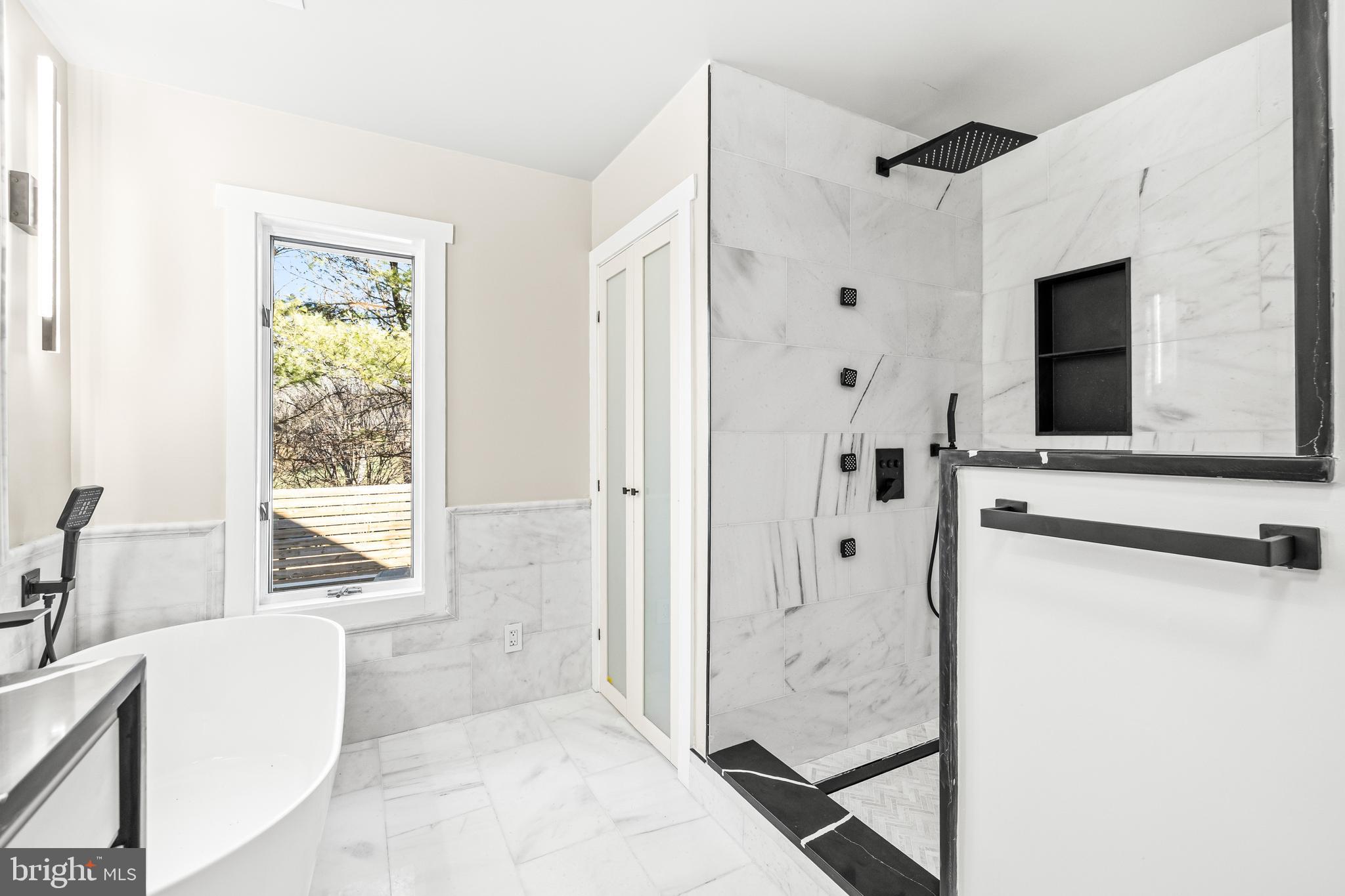 12206 Cleghorn Road Cockeysville, MD 21030 - Photo 30 of 84 a bathroom with a tub shower and a window