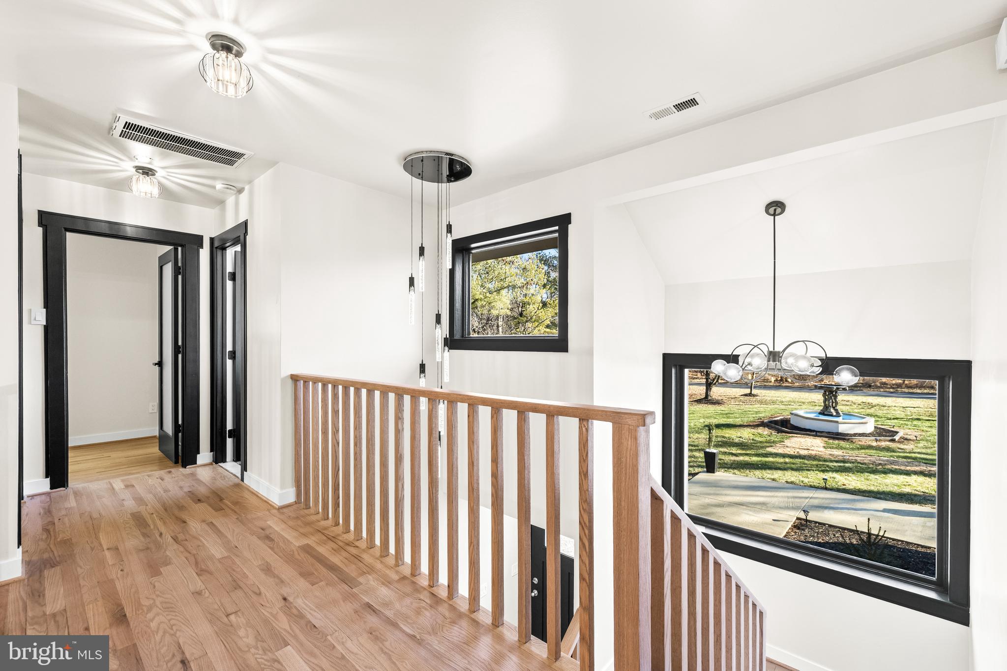 12206 Cleghorn Road Cockeysville, MD 21030 - Photo 33 of 76 a view of a hallway with wooden floor and staircase