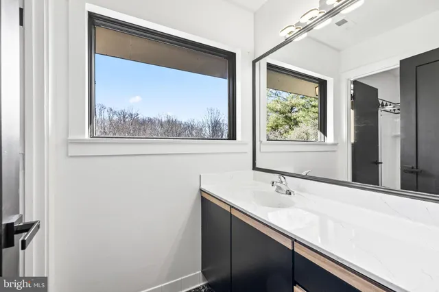 a view of a porch with furniture and a yard