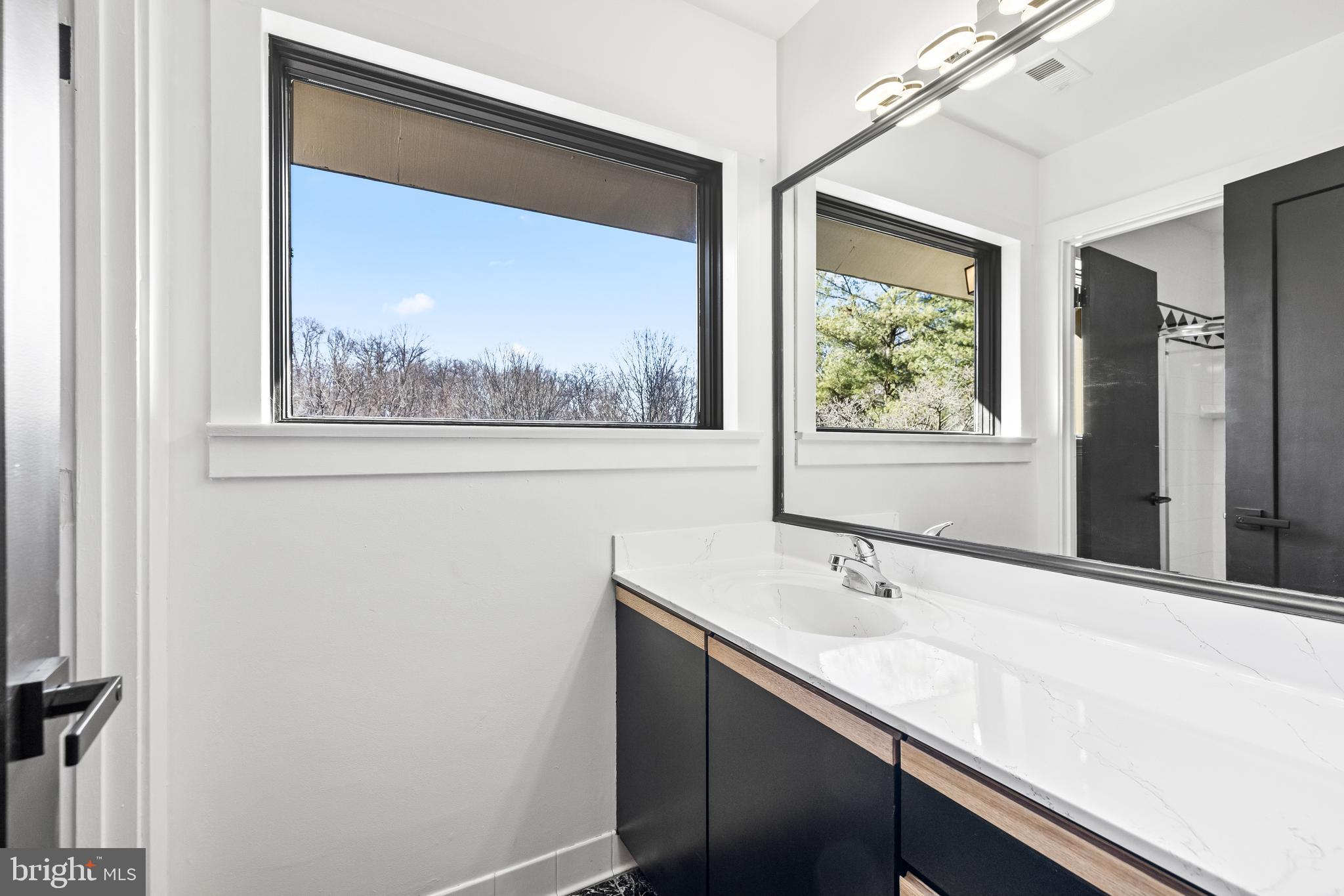 12206 Cleghorn Road Cockeysville, MD 21030 - Photo 38 of 76 a bathroom with a sink and a mirror