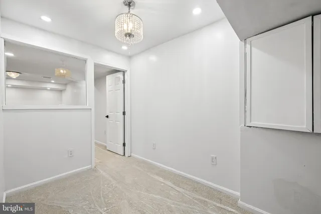 an aerial view of a house with a yard basket ball court and outdoor seating