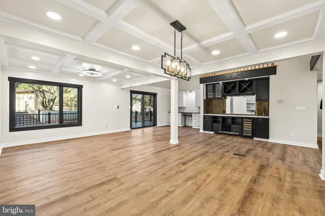 a large kitchen with stainless steel appliances kitchen island a large counter top and oven