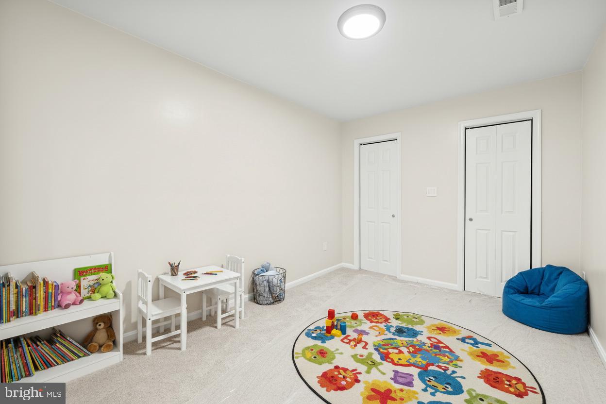 12206 Cleghorn Road Cockeysville, MD 21030 - Photo 58 of 84 a bedroom with furniture and a wooden floor