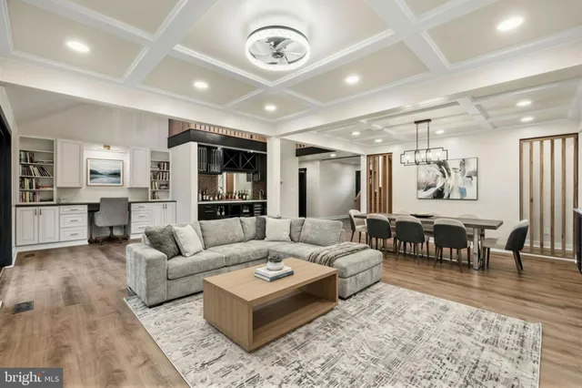 a large kitchen with a large counter top and stainless steel appliances