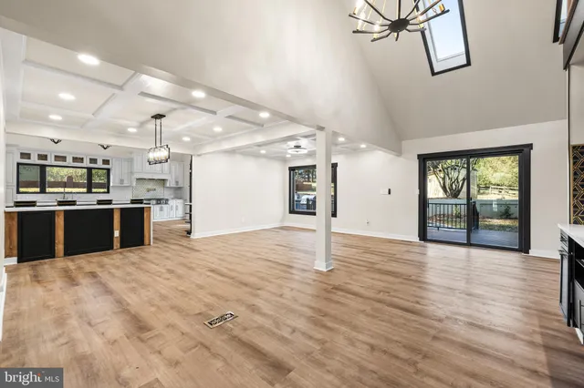 a kitchen with a refrigerator window and a sink