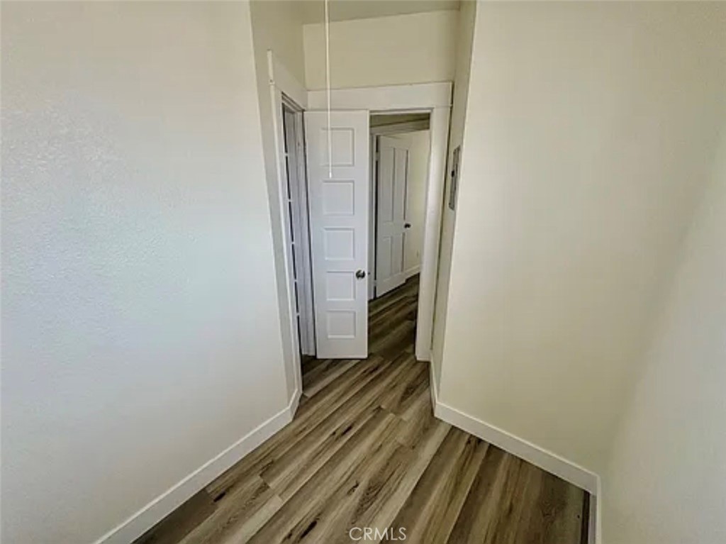 549 East 17th Street, Unit 551 Long Beach, CA 90813 - Photo 10 of 18 a view of a hallway with wooden floor