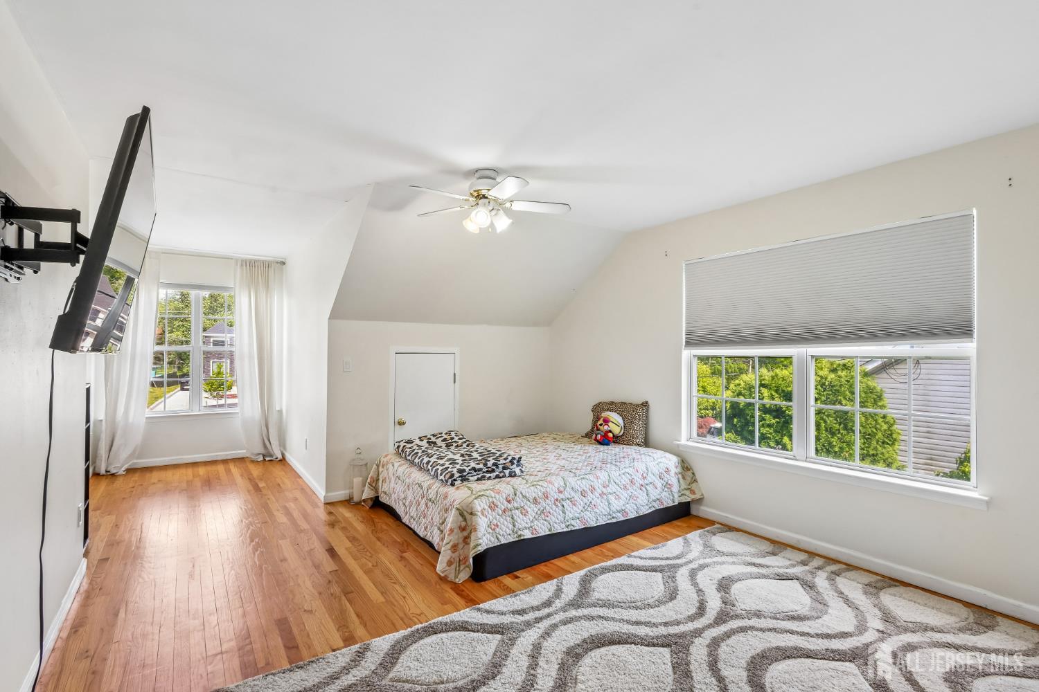 489 Plainfield Road Edison, NJ 08820 - Photo 14 of 39 a bedroom with a bed next to a window