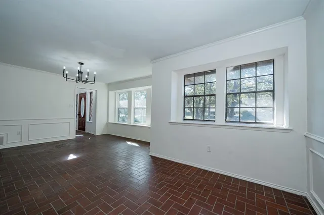 a bedroom with a large bed and a flat screen tv