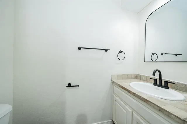 a bed room with a bed and a dresser