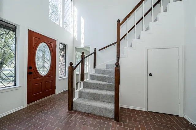 a view of entryway with wooden floor and window