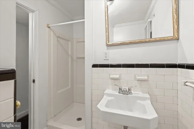 a bathroom with a sink and mirror