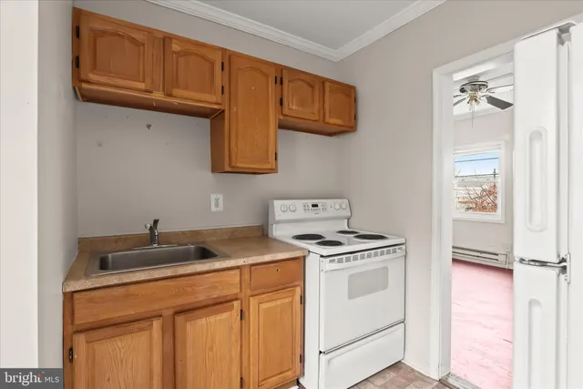 a kitchen with a stove and a microwave
