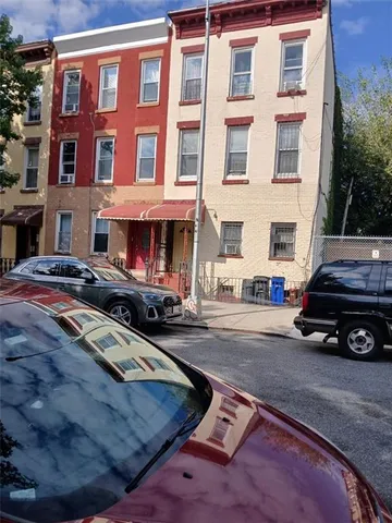 a view of a car parked in front of a building