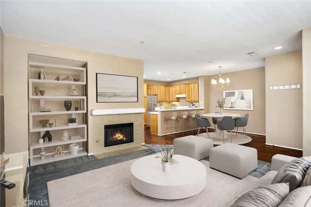 a kitchen with a refrigerator sink and cabinets