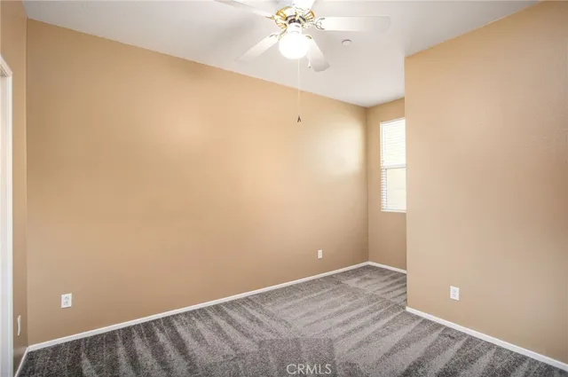 a spacious bedroom with a bed and furniture