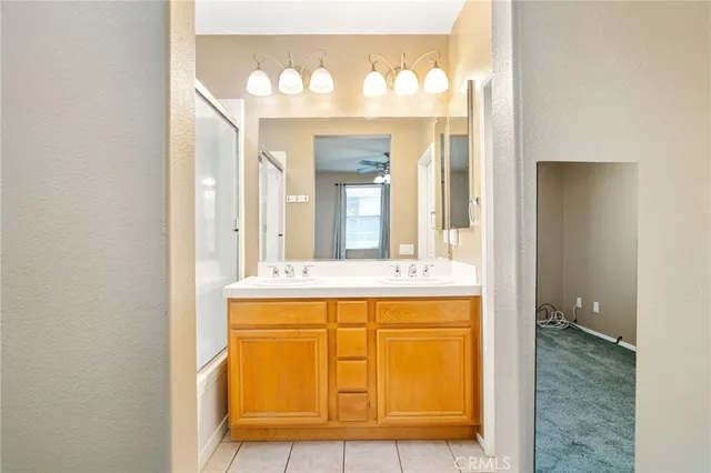 a bathroom with a shower and a window