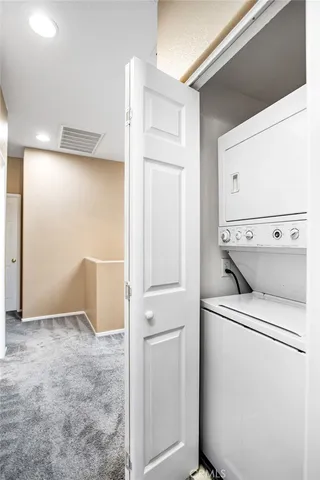 a view of a house with swimming pool and sitting area