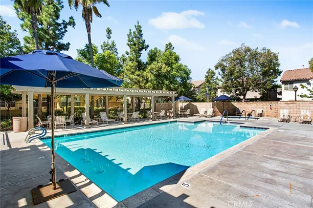 a view of a swimming pool with a patio