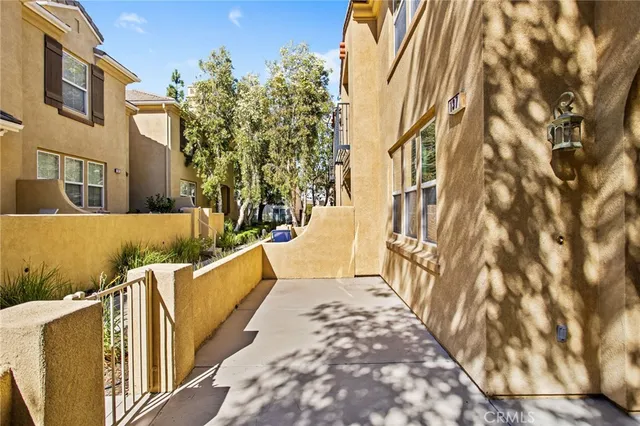 a view of a brick house with a wooden door