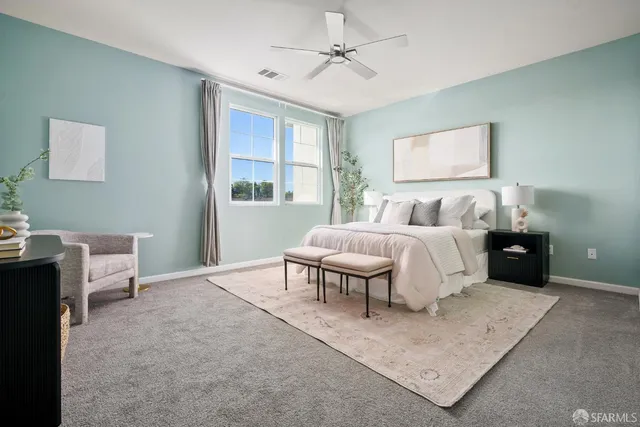 a bedroom with a bed and a table