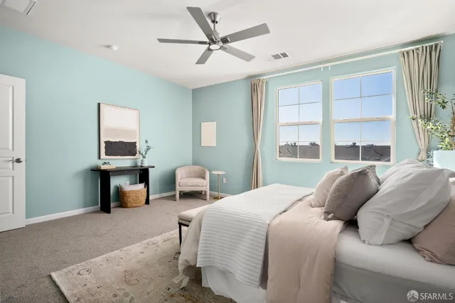 a bedroom with a bed and a couch