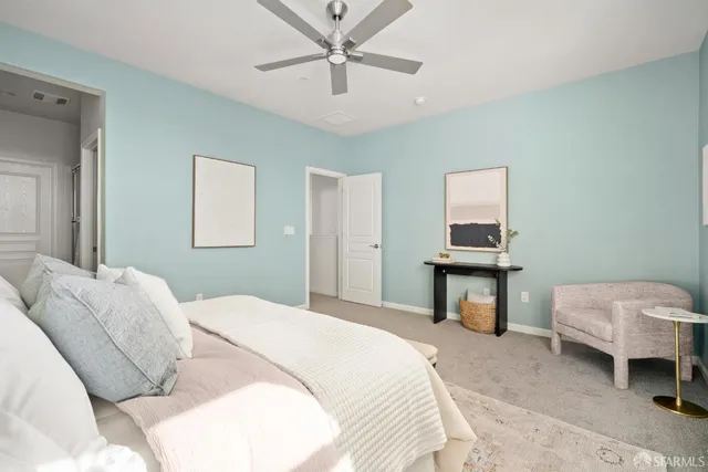 a bedroom with a bed and a tv on table