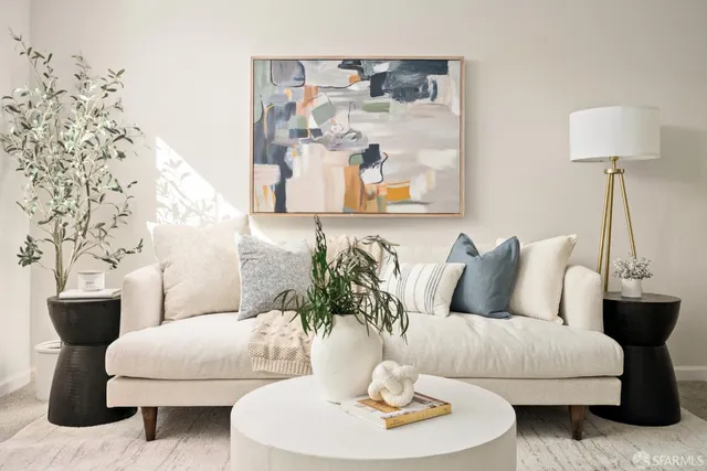 a living room with furniture and a table