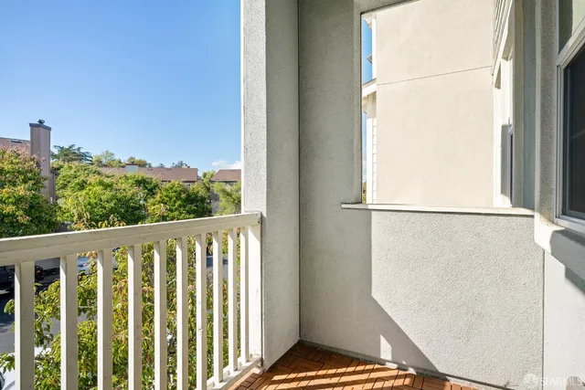 a view of balcony with wooden floor