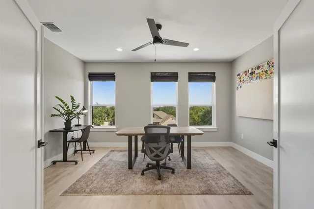a workspace with furniture window and wooden floor
