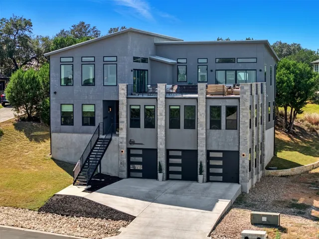a front view of a house with large windows