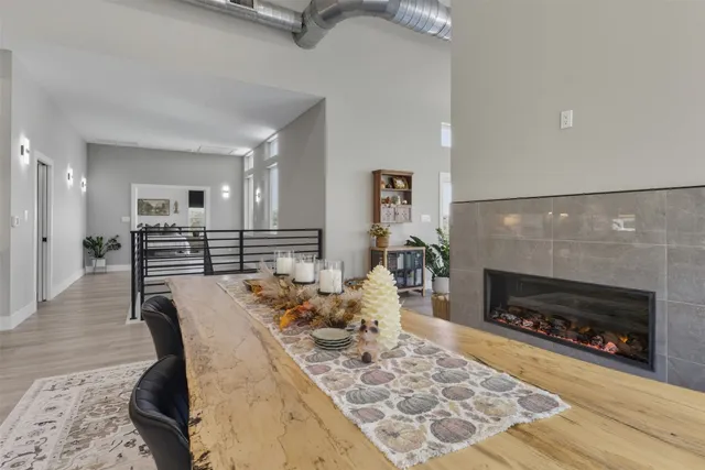 a living room with furniture a fireplace and a table