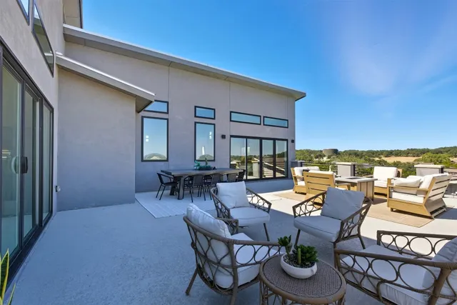 a outdoor space with patio couch and a potted plant